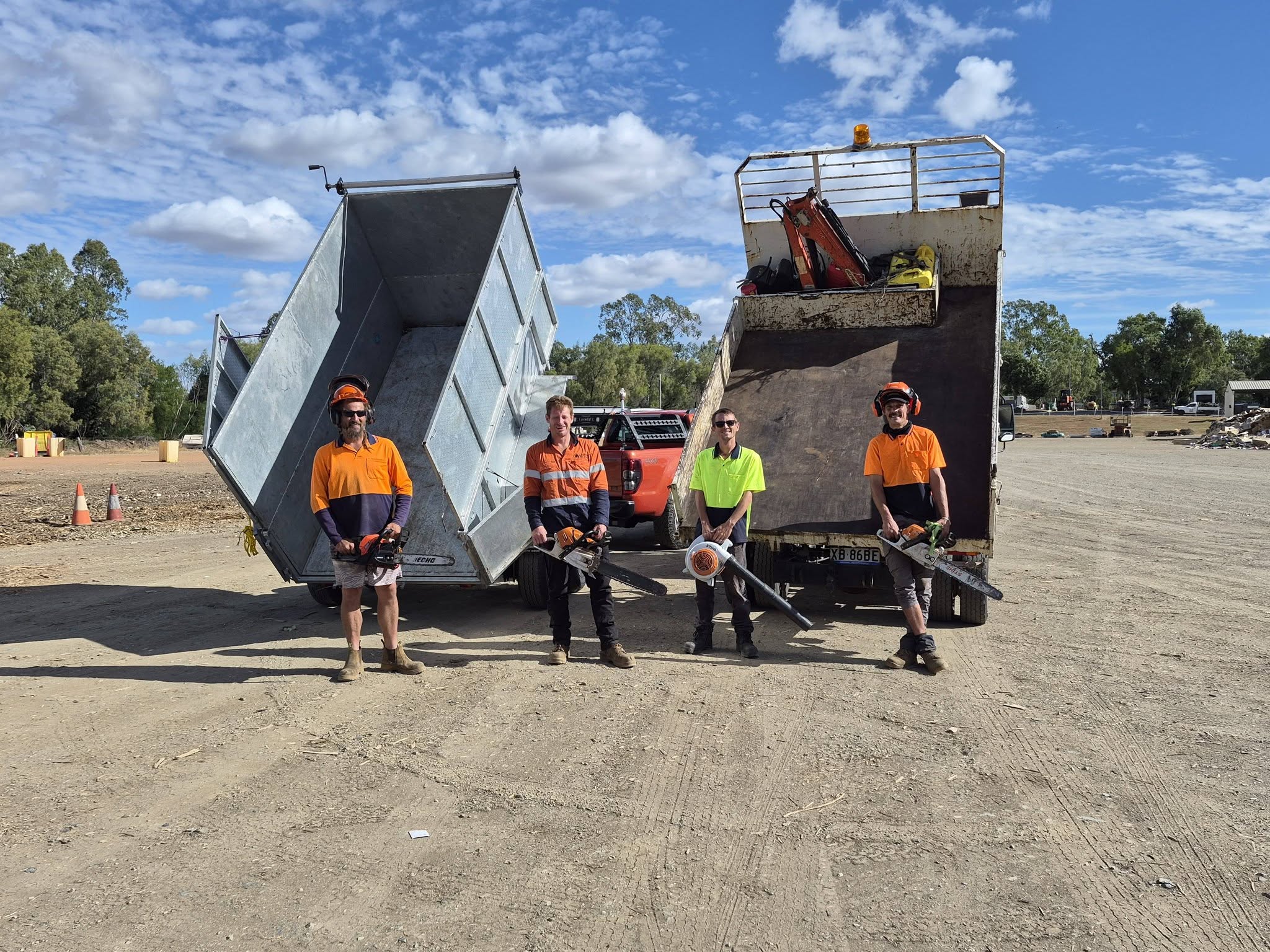 Archers crew standing with trucks and equipment